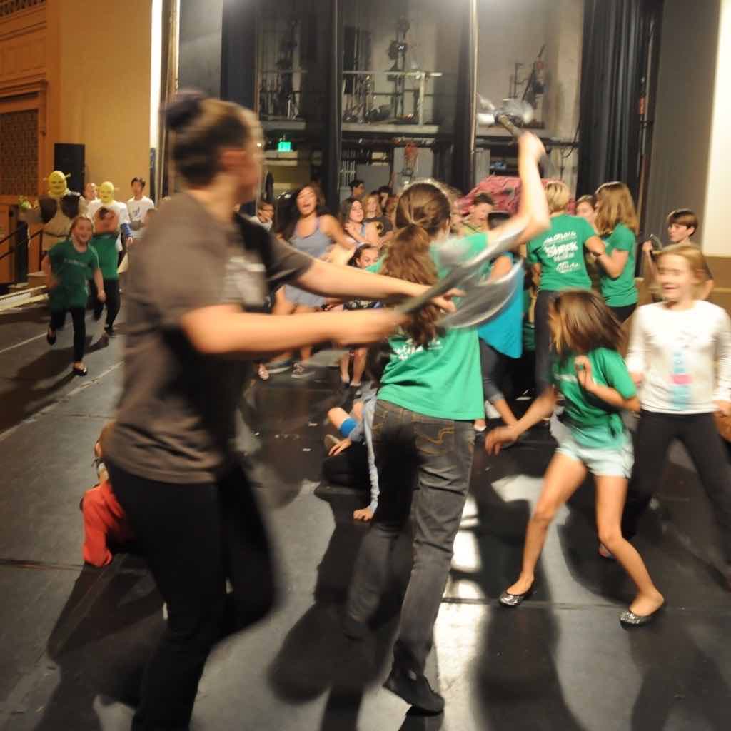 rehearsing an action sequence in a Shrek production